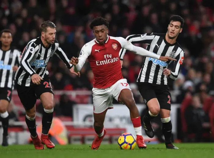 Framed Print : Arsenal's Alex Iwobi Clashes with Newcastle's Merino and Lejeune during Premier League Match