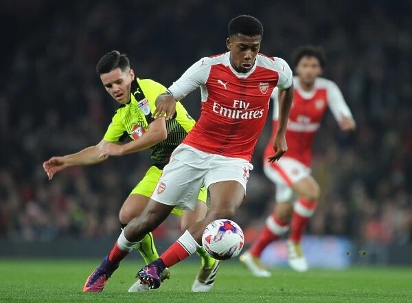 Arsenal's Alex Iwobi Clashes with Reading's Liam Kelly in EFL Cup Showdown