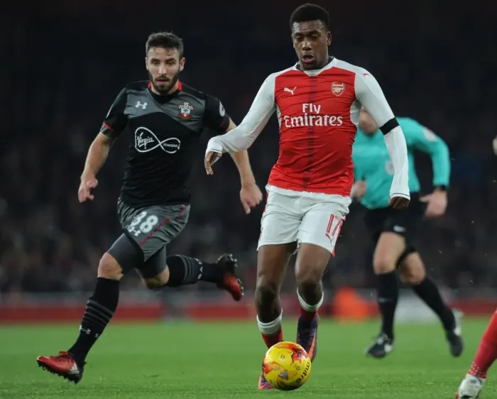 Framed Print : Arsenal's Alex Iwobi Clashes with Southampton's Sam McQueen in EFL Cup Quarter-Final Framed Print : Arsenal's Alex Iwobi Clashes with Southampton's Sam McQueen in EFL Cup Quarter-Final