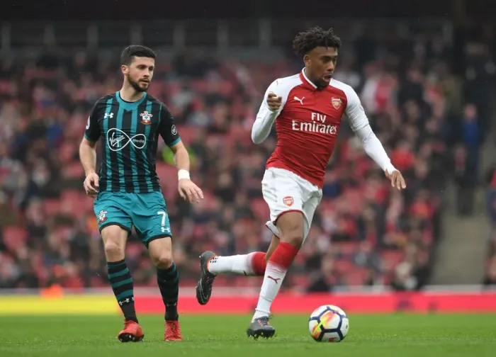Framed Print : Arsenal's Alex Iwobi Clashes with Southampton's Shane Long in Premier League Showdown Framed Print : Arsenal's Alex Iwobi Clashes with Southampton's Shane Long in Premier League Showdown