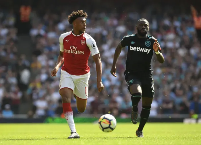 Framed Print : Arsenal's Alex Iwobi Clashes with West Ham's Arthur Masuaku in Premier League Showdown