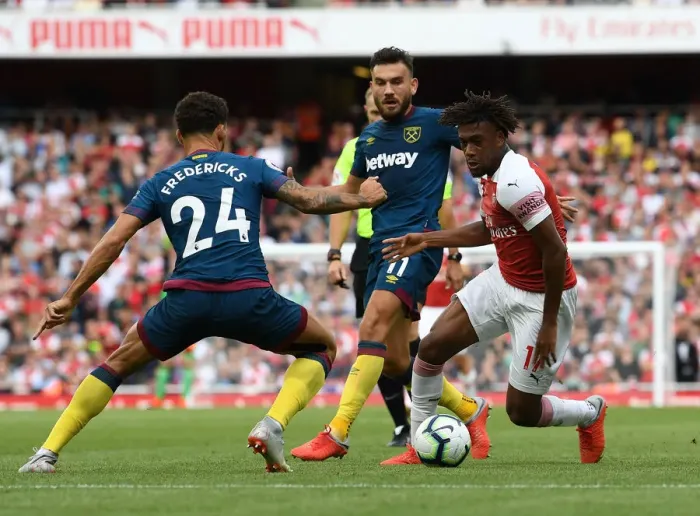 Framed Print : Arsenal's Alex Iwobi Clashes with West Ham's Snodgrass and Fredericks Framed Print : Arsenal's Alex Iwobi Clashes with West Ham's Snodgrass and Fredericks