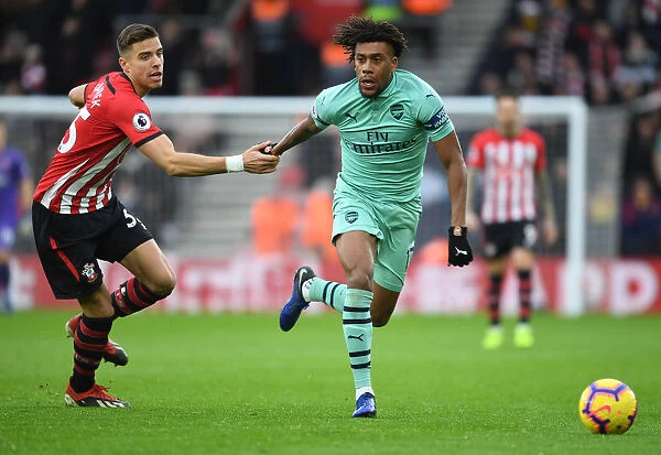 Arsenal's Alex Iwobi Dashes Past Southampton's Jan Bednarek in Premier League Clash