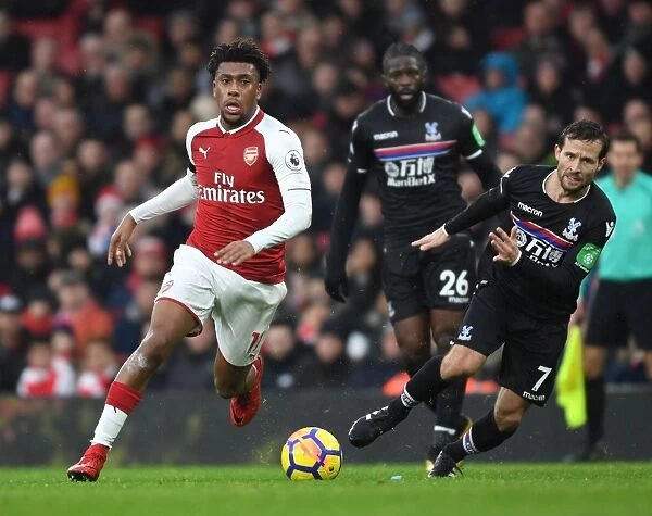 Arsenal's Alex Iwobi Faces Off Against Crystal Palace's Yohan Cabaye in Premier League Clash