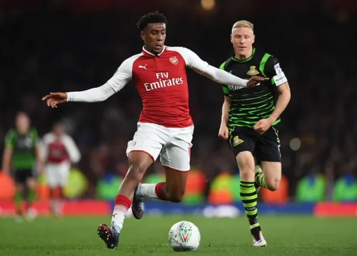 Framed Print : Arsenal's Alex Iwobi Faces Off Against Doncaster's Craig Alcock in Carabao Cup Clash Framed Print : Arsenal's Alex Iwobi Faces Off Against Doncaster's Craig Alcock in Carabao Cup Clash