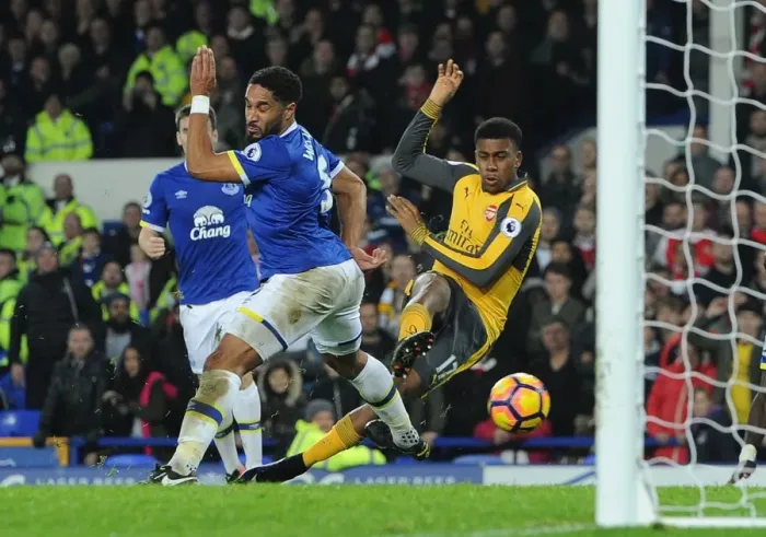 Framed Print : Arsenal's Alex Iwobi Faces Off Against Everton's Ashley Williams in Intense Premier League Showdown Framed Print : Arsenal's Alex Iwobi Faces Off Against Everton's Ashley Williams in Intense Premier League Showdown