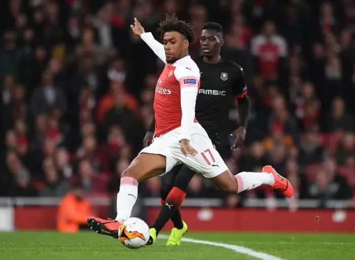 Framed Print : Arsenal's Alex Iwobi Faces Off Against Ismaila Sarr in Intense Europa League Clash