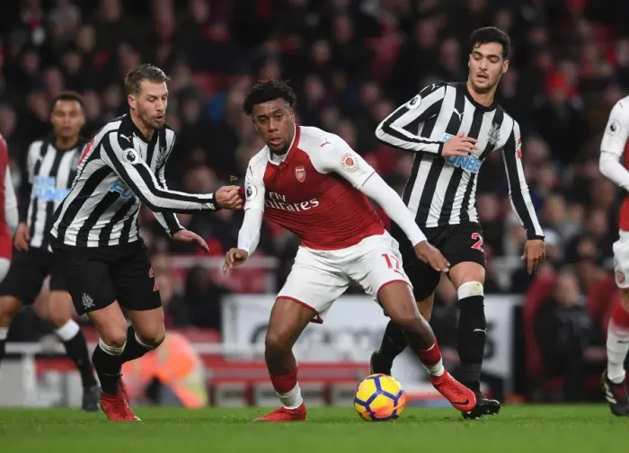 Framed Print : Arsenal's Alex Iwobi Faces Off Against Newcastle's Mikel Merino and Florian Lejeune Framed Print : Arsenal's Alex Iwobi Faces Off Against Newcastle's Mikel Merino and Florian Lejeune