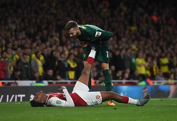 Arsenal's Alex Iwobi Faces Off Against Norwich's Angus Gunn in Carabao Cup Clash