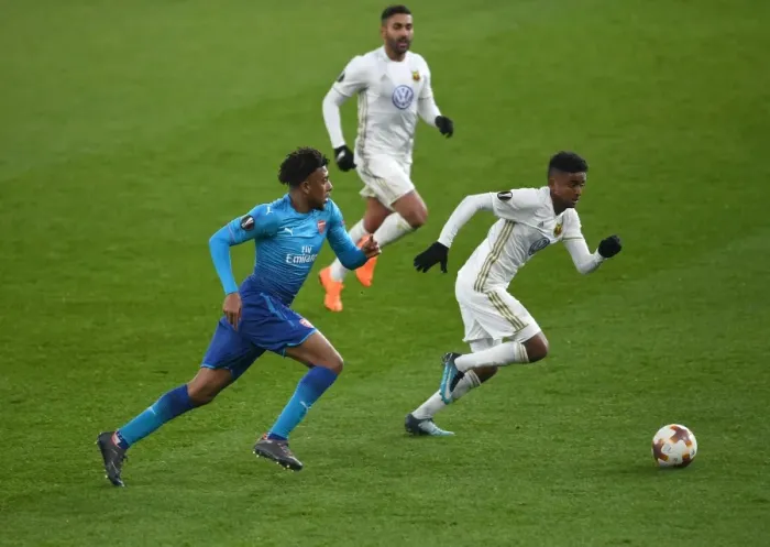 Framed Print : Arsenal's Alex Iwobi Faces Off Against Östersunds Tesfaldet Tekie in Europa League Clash Framed Print : Arsenal's Alex Iwobi Faces Off Against Östersunds Tesfaldet Tekie in Europa League Clash