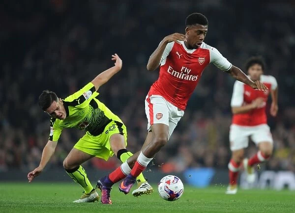 Arsenal's Alex Iwobi Faces Off Against Reading's Liam Kelly in EFL Cup Clash