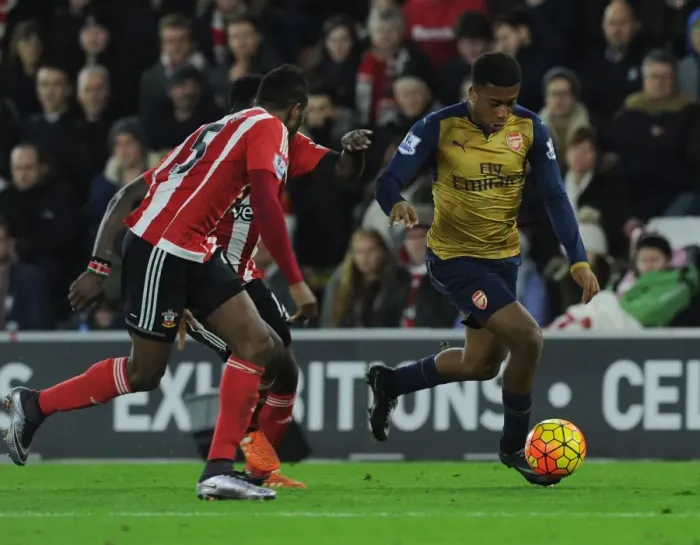 Framed Print : Arsenal's Alex Iwobi Faces Off Against Southampton's Cuco Martina in Intense Premier League Clash (December 2015)