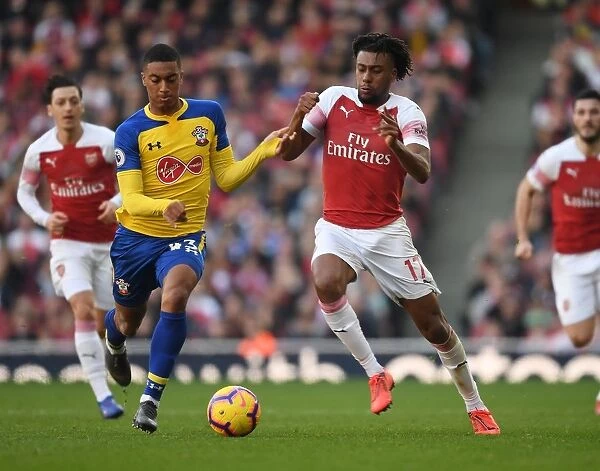 Arsenal's Alex Iwobi Faces Off Against Southampton's Yan Valery in Premier League Clash