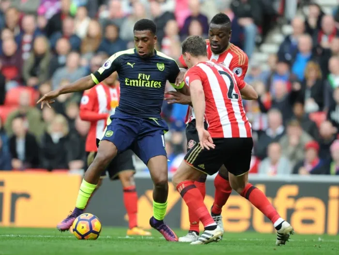 Framed Print : Arsenal's Alex Iwobi Faces Off Against Sunderland's Billy Jones in Premier League Clash Framed Print : Arsenal's Alex Iwobi Faces Off Against Sunderland's Billy Jones in Premier League Clash
