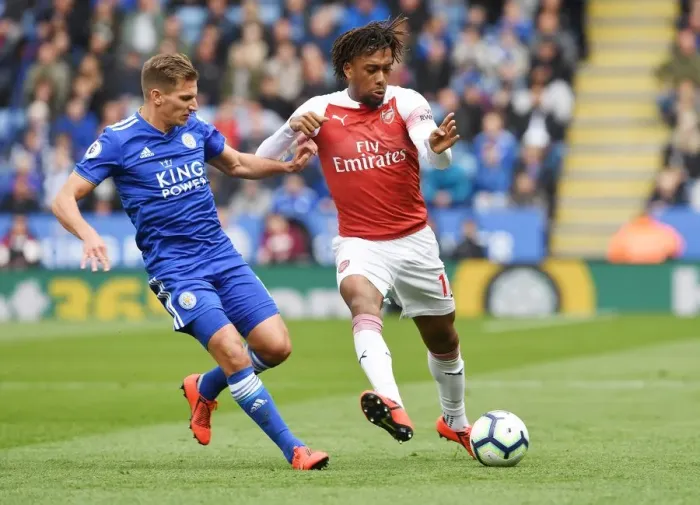 Framed Print : Arsenal's Alex Iwobi Fends Off Leicester's Marc Albrighton in Intense Premier League Clash