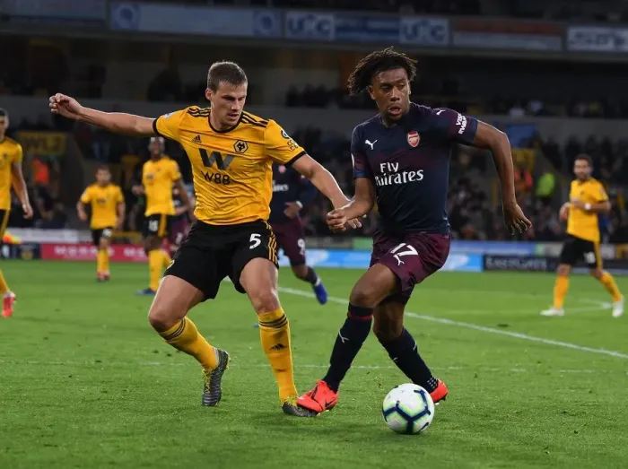 Framed Print : Arsenal's Alex Iwobi Fends Off Wolves Ryan Bennett During Intense Premier League Clash (Wolverhampton Wanderers vs Arsenal, 2018-19) Framed Print : Arsenal's Alex Iwobi Fends Off Wolves Ryan Bennett During Intense Premier League Clash (Wolverhampton Wanderers vs Arsenal, 2018-19)