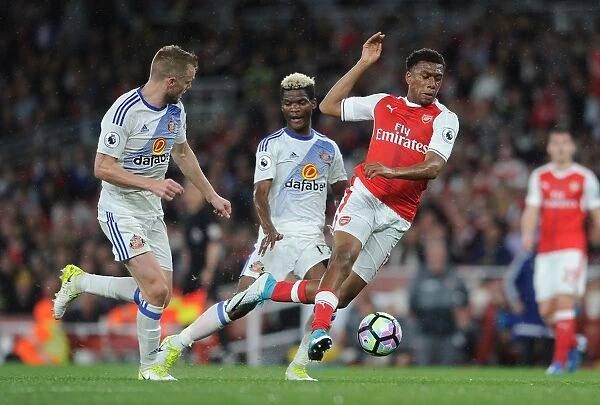 Arsenal's Alex Iwobi Fouled by Sunderland's Didier Ndong during Premier League Match