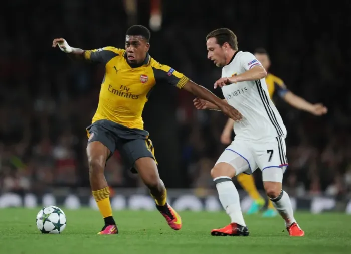 Framed Print : Arsenal's Alex Iwobi Goes Head-to-Head with FC Basel's Luca Lang in 2016-17 UEFA Champions League Showdown Framed Print : Arsenal's Alex Iwobi Goes Head-to-Head with FC Basel's Luca Lang in 2016-17 UEFA Champions League Showdown