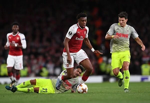 Arsenal's Alex Iwobi Goes Head-to-Head with FC Köln's Leonardo Bittencourt and Milos Jojic in Europa League Showdown