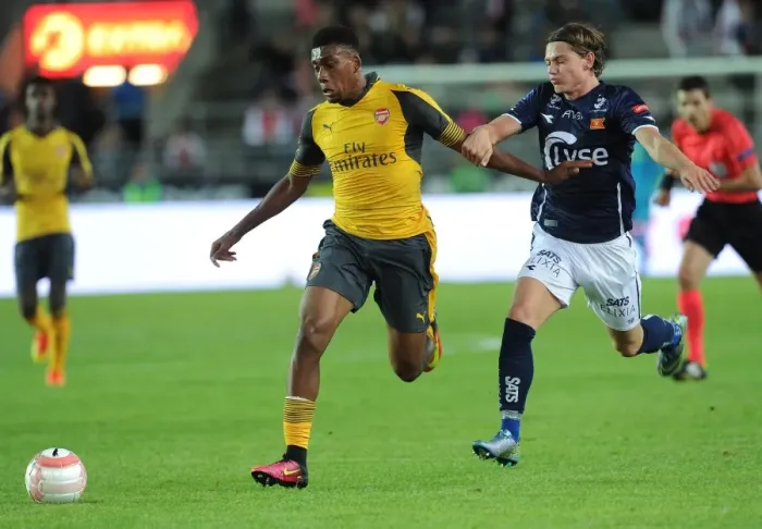 Framed Print : Arsenal's Alex Iwobi Goes Head-to-Head with Julian Ryerston in Viking FK Friendly Framed Print : Arsenal's Alex Iwobi Goes Head-to-Head with Julian Ryerston in Viking FK Friendly