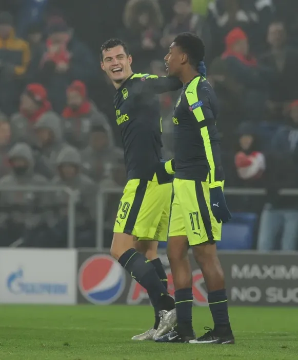 Framed Print : Arsenal's Alex Iwobi and Granit Xhaka Celebrate Goals Against FC Basel in 2016-17 UEFA Champions League