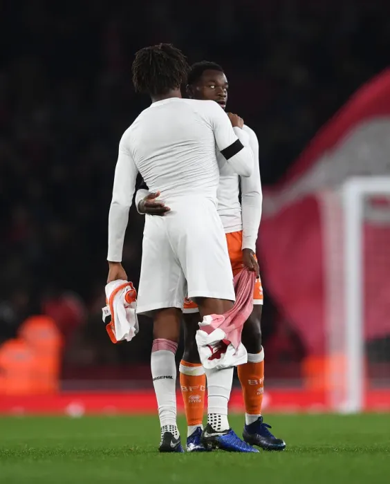 Framed Print : Arsenal's Alex Iwobi and Marc Bola of Blackpool Exchange Shirts After Carabao Cup Match Framed Print : Arsenal's Alex Iwobi and Marc Bola of Blackpool Exchange Shirts After Carabao Cup Match