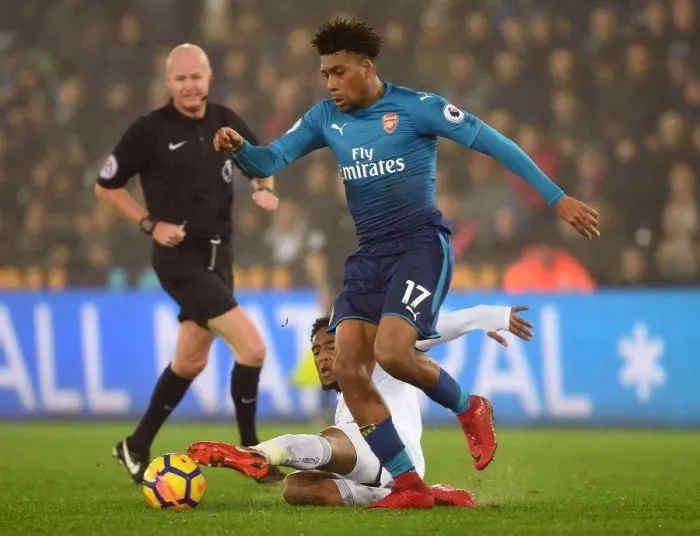 Framed Print : Arsenal's Alex Iwobi Outmaneuvers Swansea's Leroy Fer in Intense Premier League Clash Framed Print : Arsenal's Alex Iwobi Outmaneuvers Swansea's Leroy Fer in Intense Premier League Clash