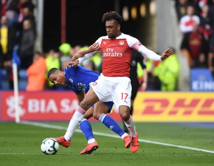Framed Print : Arsenal's Alex Iwobi Outsmarts Tielemans: A Premier League Tactical Showdown - Arsenal vs. Leicester