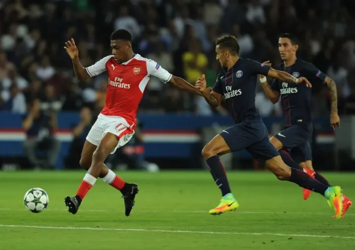 Framed Print : Arsenal's Alex Iwobi Overpowers Marquinhos in Champions League Clash Framed Print : Arsenal's Alex Iwobi Overpowers Marquinhos in Champions League Clash
