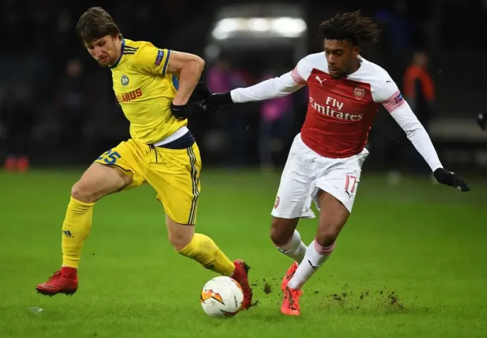 Framed Print : Arsenal's Alex Iwobi vs. Dmitri Baga: A Europa League Battle at BATE Borisov Framed Print : Arsenal's Alex Iwobi vs. Dmitri Baga: A Europa League Battle at BATE Borisov