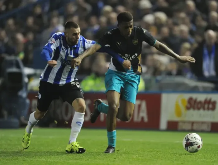 Framed Print : Arsenal's Alex Iwobi vs Jack Hunt in Capital One Cup Showdown Framed Print : Arsenal's Alex Iwobi vs Jack Hunt in Capital One Cup Showdown