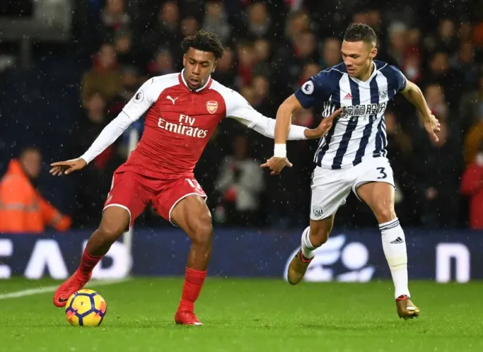 Framed Print : Arsenal's Alex Iwobi vs. Kieran Gibbs: A Premier League Face-Off Framed Print : Arsenal's Alex Iwobi vs. Kieran Gibbs: A Premier League Face-Off