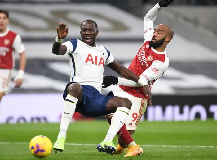 Framed Print : Arsenal's Alex Lacazette Clashes with Tottenham's Moussa Sissoko in the 2020-21 Premier League Showdown