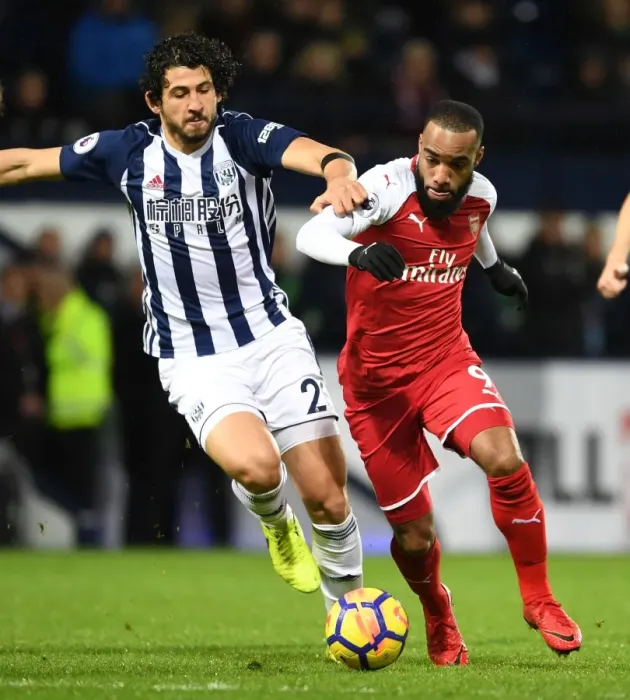 Framed Print : Arsenal's Alex Lacazette Clashes with West Brom's Ahmed Hegazi in Premier League Showdown