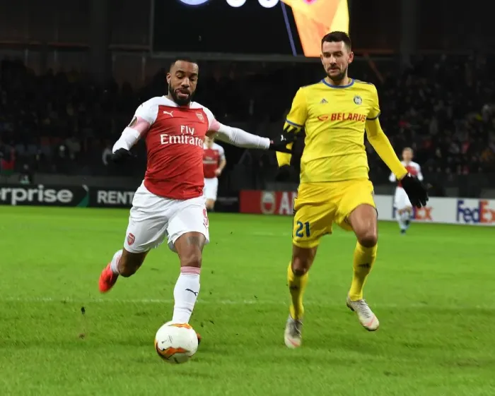 Framed Print : Arsenal's Alex Lacazette Faces Off Against BATE Borisov's Yegor Filipenko in UEFA Europa League Clash
