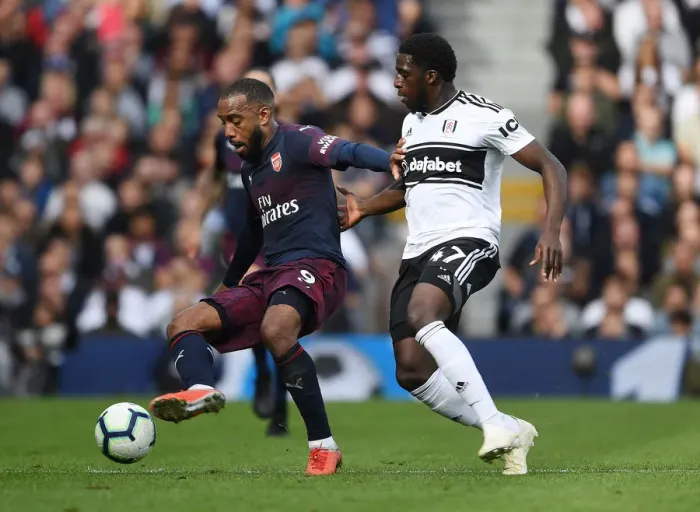 Framed Print : Arsenal's Alex Lacazette Faces Off Against Fulham's Aboubakar Kamara in Premier League Clash