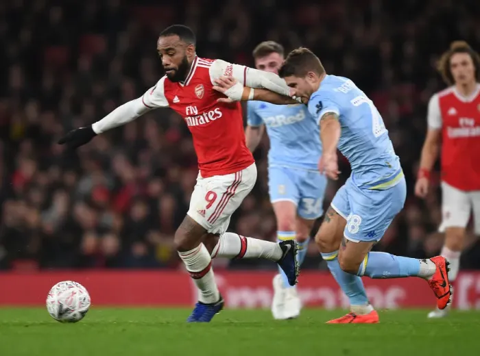 Framed Print : Arsenal's Alex Lacazette Fends Off Leeds Gaetano Berardi in FA Cup Clash Framed Print : Arsenal's Alex Lacazette Fends Off Leeds Gaetano Berardi in FA Cup Clash