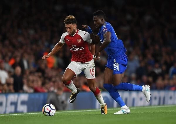 Arsenal's Alex Oxlade-Chamberlain Clashes with Leicester's Daniel Amartey in Premier League Showdown