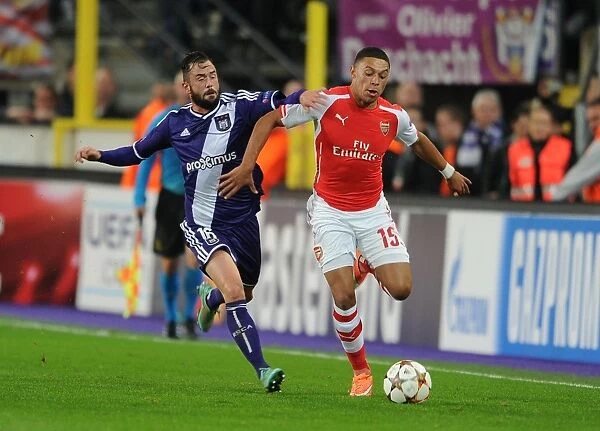 Arsenal's Alex Oxlade-Chamberlain Faces Off Against Anderlecht's Steven Defour in Champions League Clash