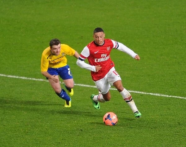 Arsenal's Alex Oxlade-Chamberlain Faces Off Against Coventry's John Fleck in FA Cup Fourth Round Clash