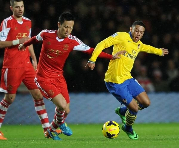 Arsenal's Alex Oxlade-Chamberlain Faces Off Against Southampton's Maya Yoshida in Premier League Clash