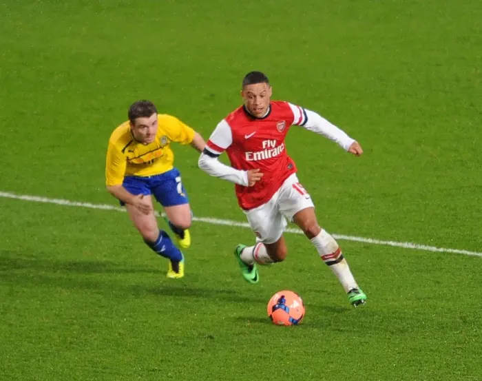 Framed Print : Arsenal's Alex Oxlade-Chamberlain Faces Off Against Coventry's John Fleck in FA Cup Fourth Round Clash