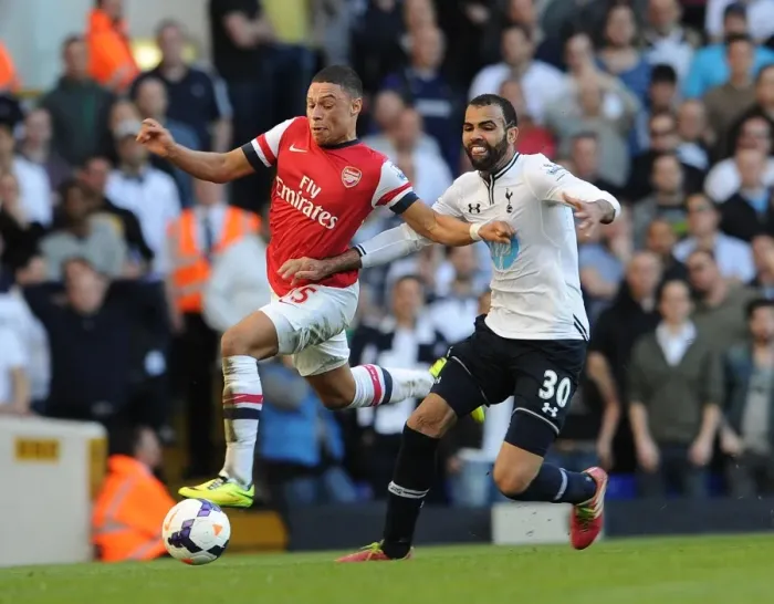 Framed Print : Arsenal's Alex Oxlade-Chamberlain Faces Off Against Tottenham's Sandro in Premier League Clash