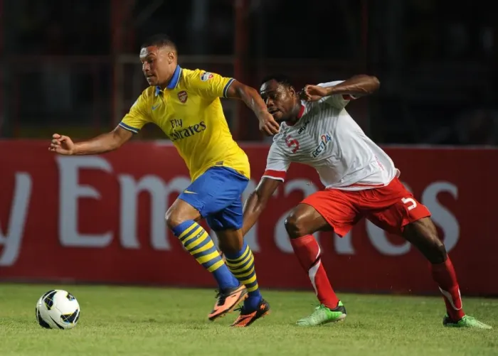 Framed Print : Arsenal's Alex Oxlade-Chamberlain Faces Off Against Victor Igbonefo of Indonesia Dream Team Framed Print : Arsenal's Alex Oxlade-Chamberlain Faces Off Against Victor Igbonefo of Indonesia Dream Team