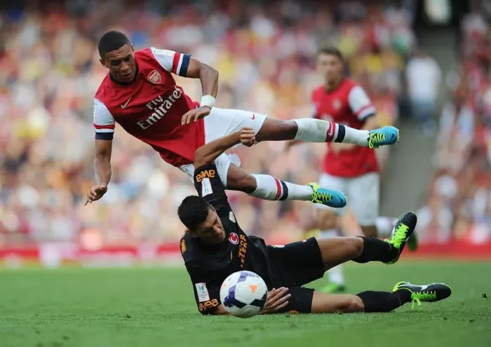 Framed Print : Arsenal's Alex Oxlade-Chamberlain Fouls by Galatasaray's Ceyhun Gulselam - Emirates Cup 2013 Framed Print : Arsenal's Alex Oxlade-Chamberlain Fouls by Galatasaray's Ceyhun Gulselam - Emirates Cup 2013