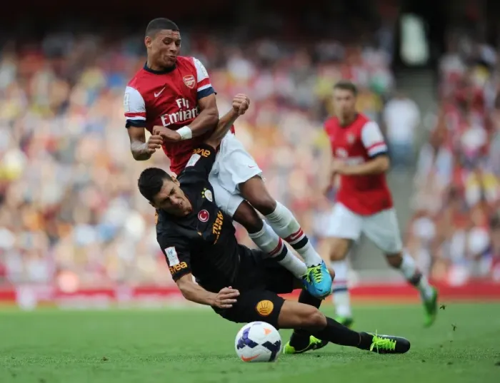 Framed Print : Arsenal's Alex Oxlade-Chamberlain Fouls by Galatasaray's Ceyhun Gulselam - Emirates Cup 2013