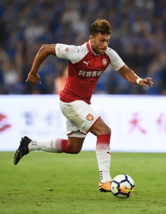 Framed Print : Arsenal's Alex Oxlade-Chamberlain Goes Head-to-Head with Chelsea in Beijing Pre-Season Clash