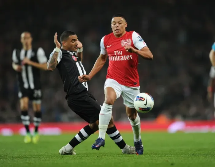 Framed Print : Arsenal's Alex Oxlade-Chamberlain Surges Past Newcastle's Danny Simpson in 2011-12 Premier League Clash
