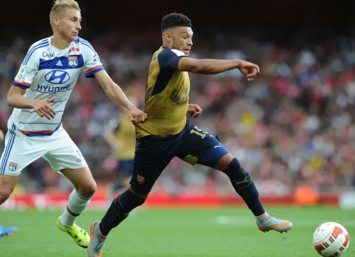 Framed Print : Arsenal's Alex Oxlade-Chamberlain vs. Olympique Lyonnais Ulrich Jennsen: A Clash at the Emirates Cup 2015 / 16 Framed Print : Arsenal's Alex Oxlade-Chamberlain vs. Olympique Lyonnais Ulrich Jennsen: A Clash at the Emirates Cup 2015 / 16