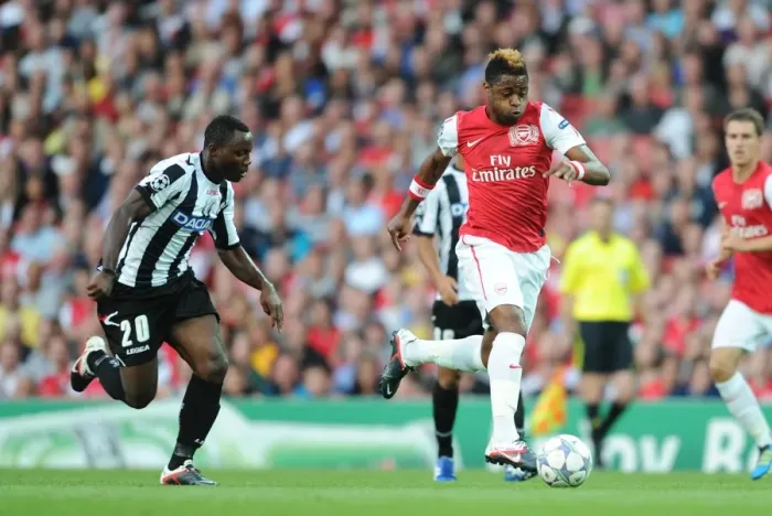 Framed Print : Arsenal's Alex Song Battles Past Udinese's Kwadwo Asamoah in 2011-12 Champions League Play-Off